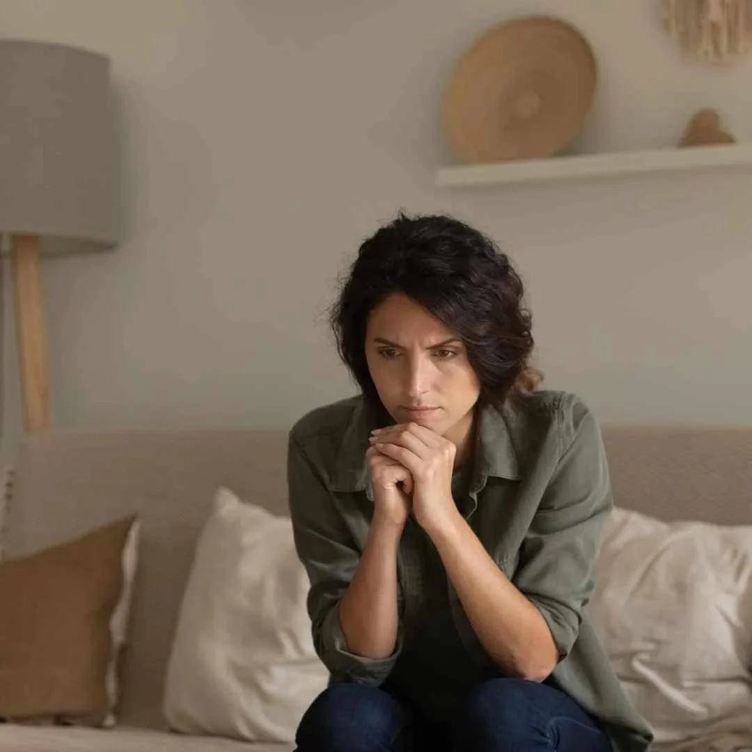 Relaxed man with eyes closed during hypnotherapy session at a therapeutic appointment