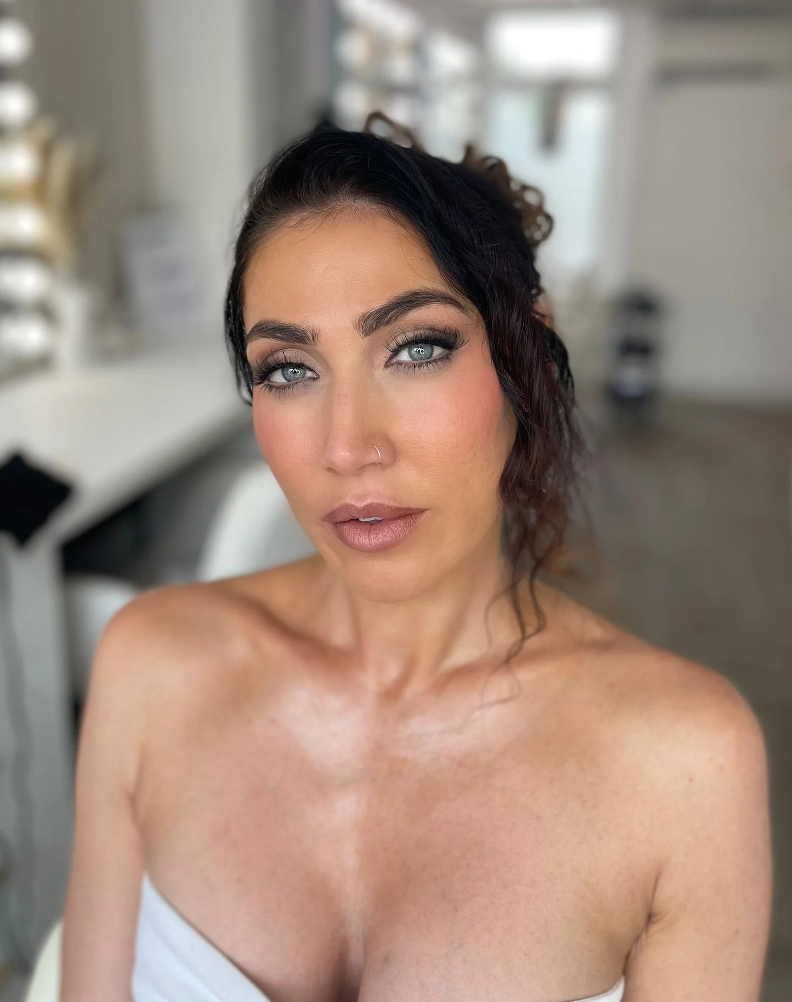 Matte soft glam look with highlighted collar bones