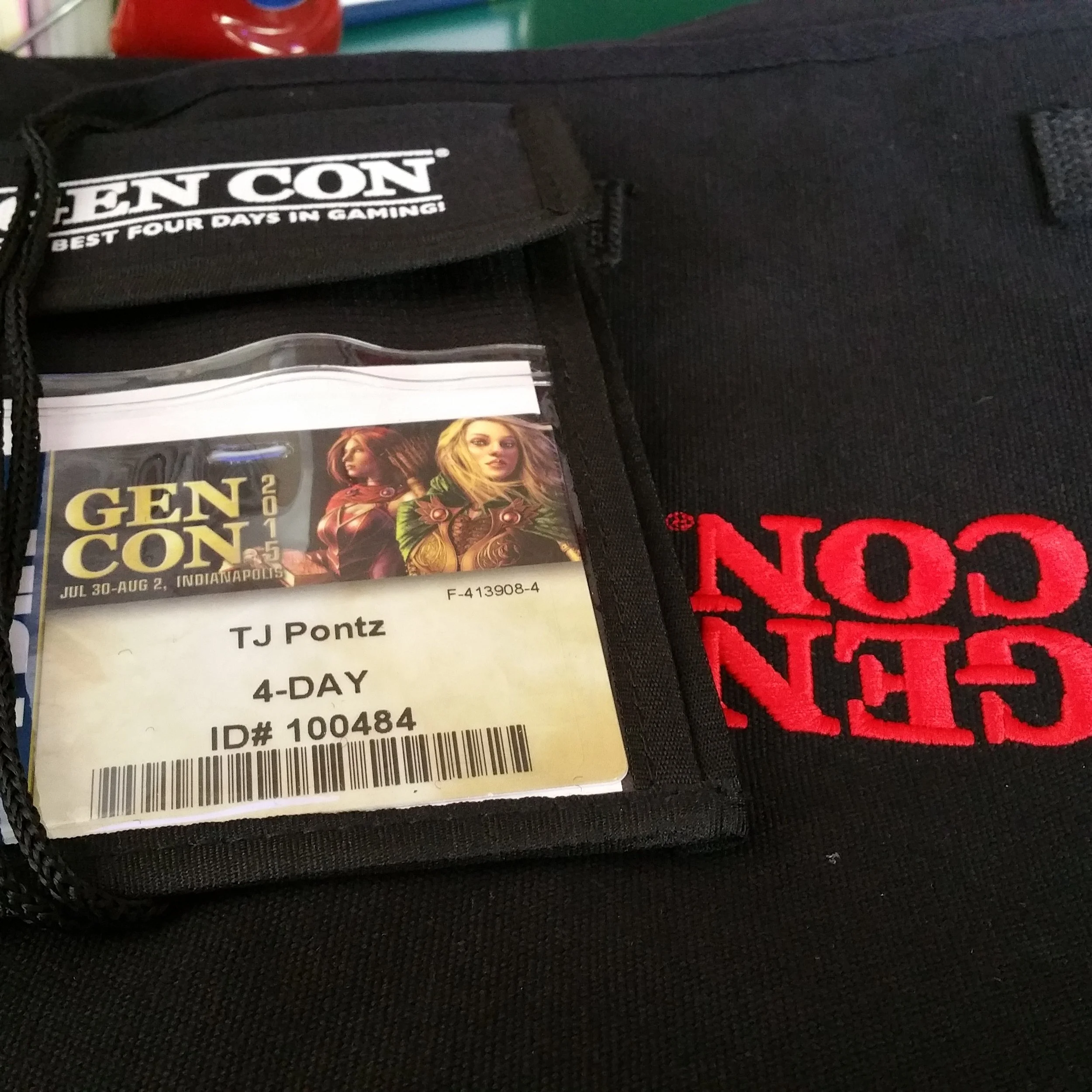 Close-up of a ticket for the Gen Con gaming convention in Indianapolis, from July 30 to August 2, 2015, with promotional images of female characters from the game Destiny 2.