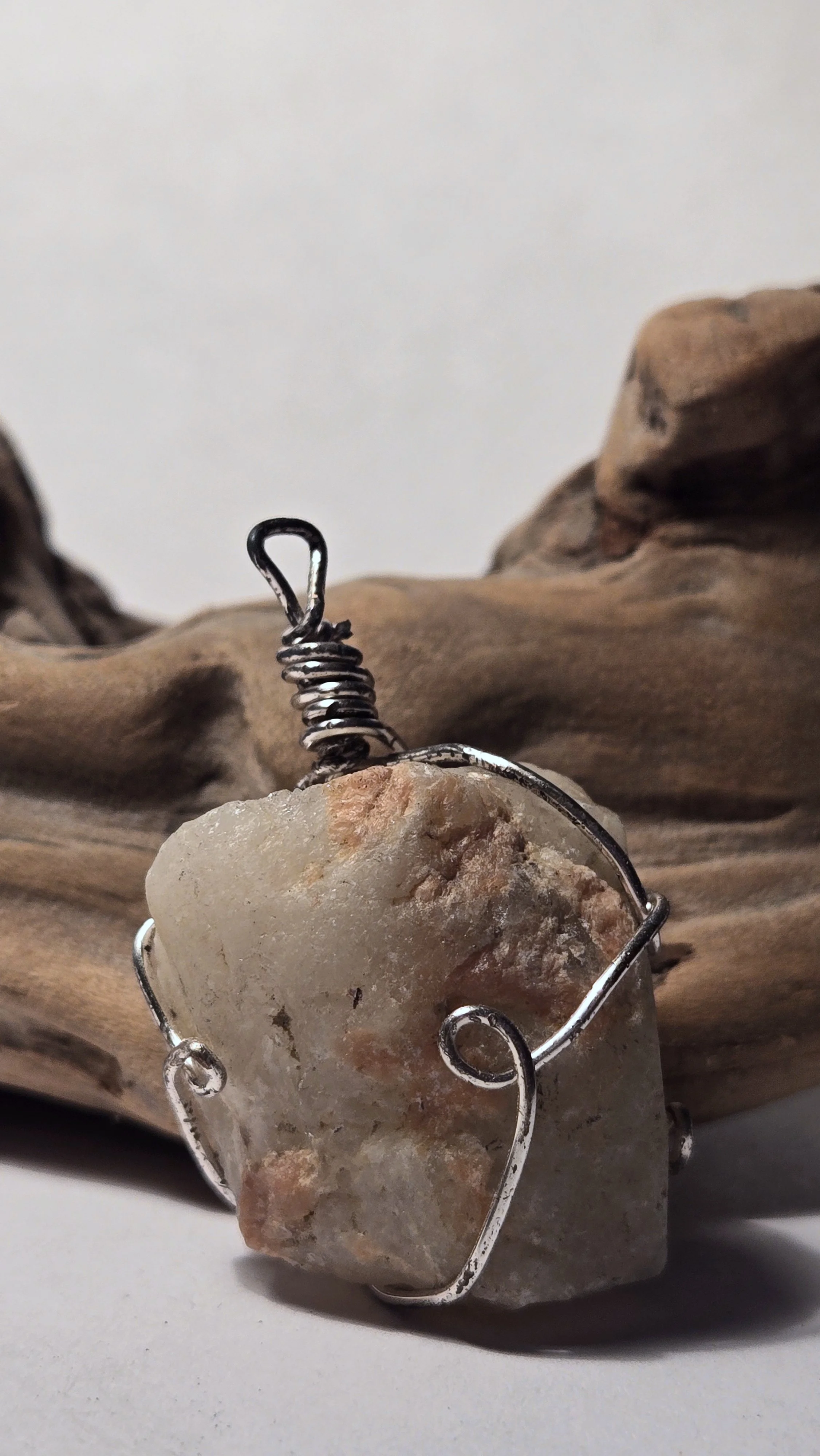 Two-tone quartz pendant with silver wire
