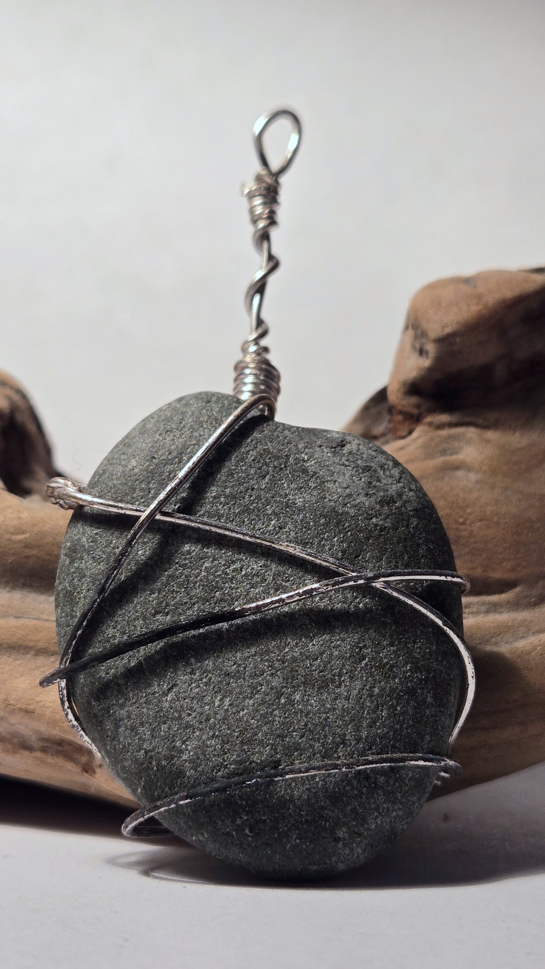 Matte grey rock pendant with aged silver wire