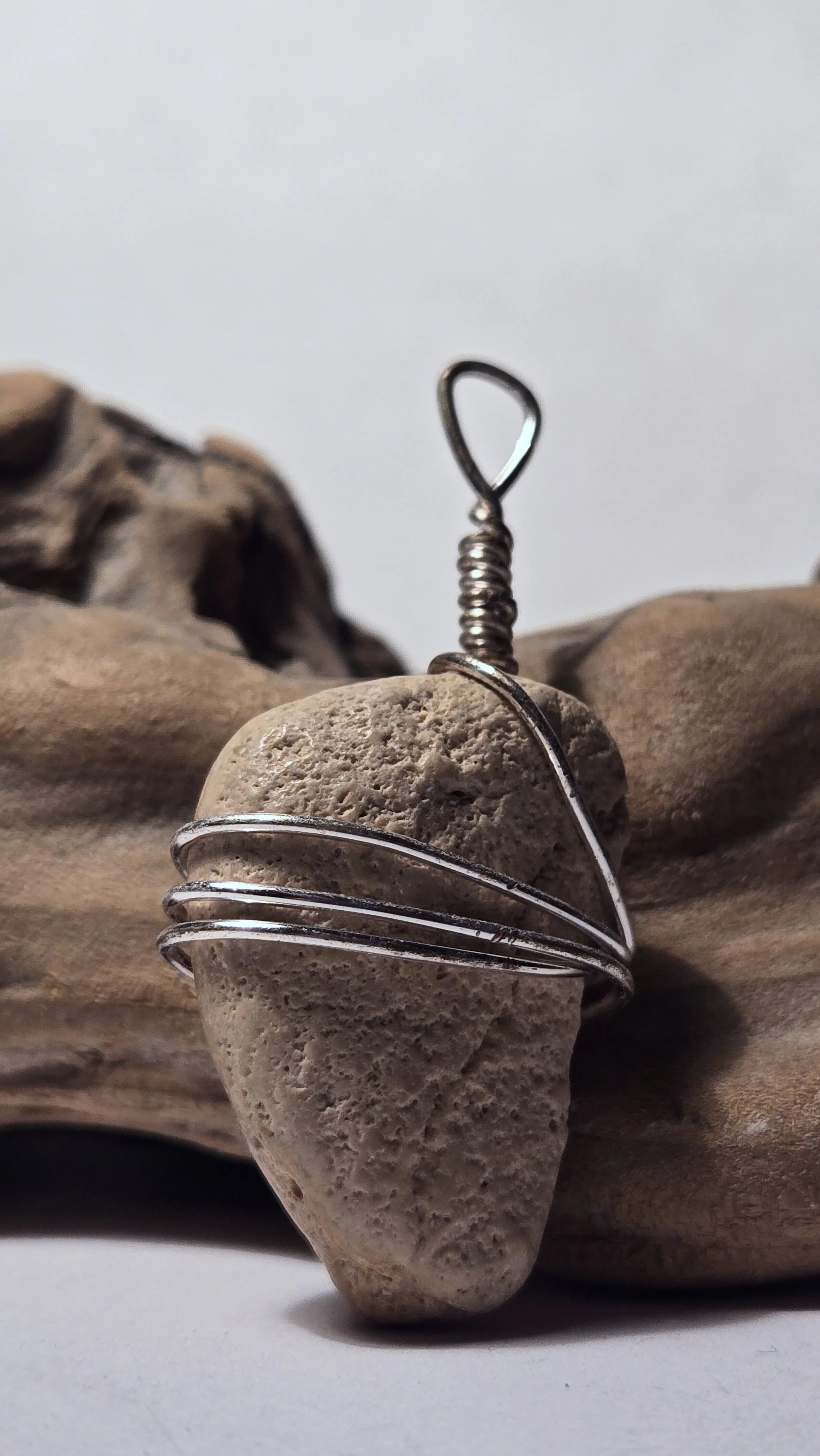 Light brown coral pendant with silver wire