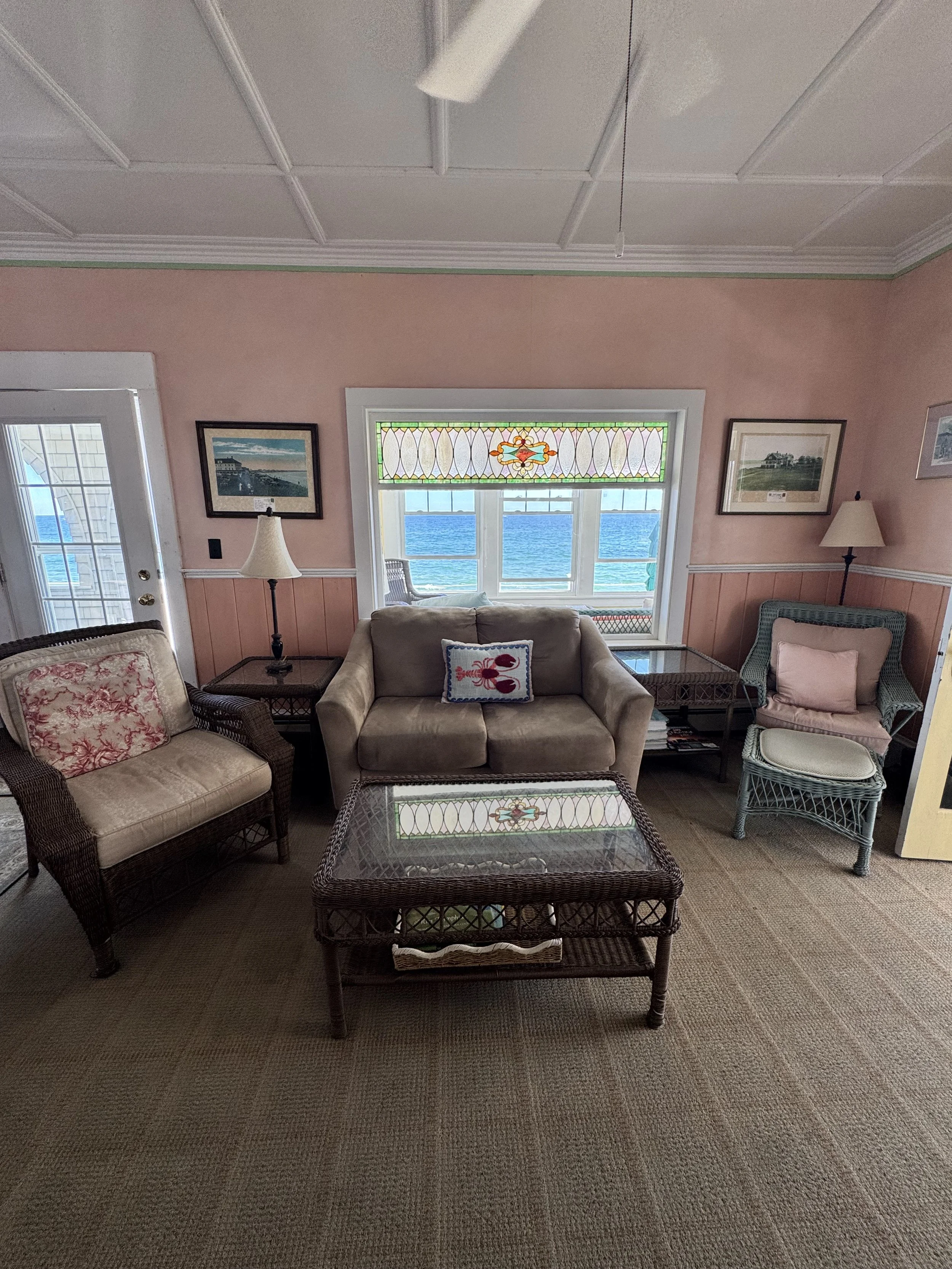 The living room provides ample seating and ocean views. 