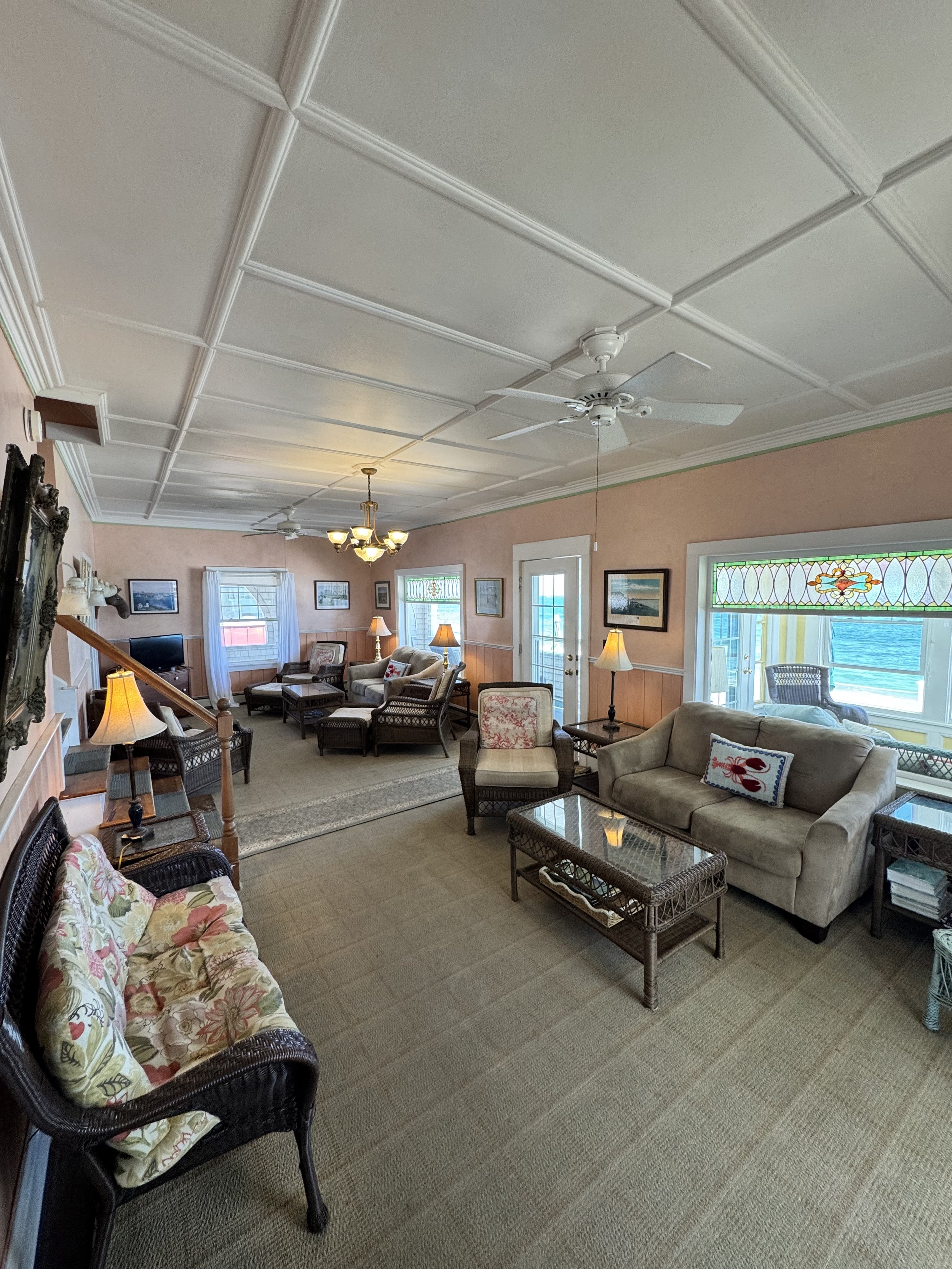 Original stain glass windows grace the living room. 