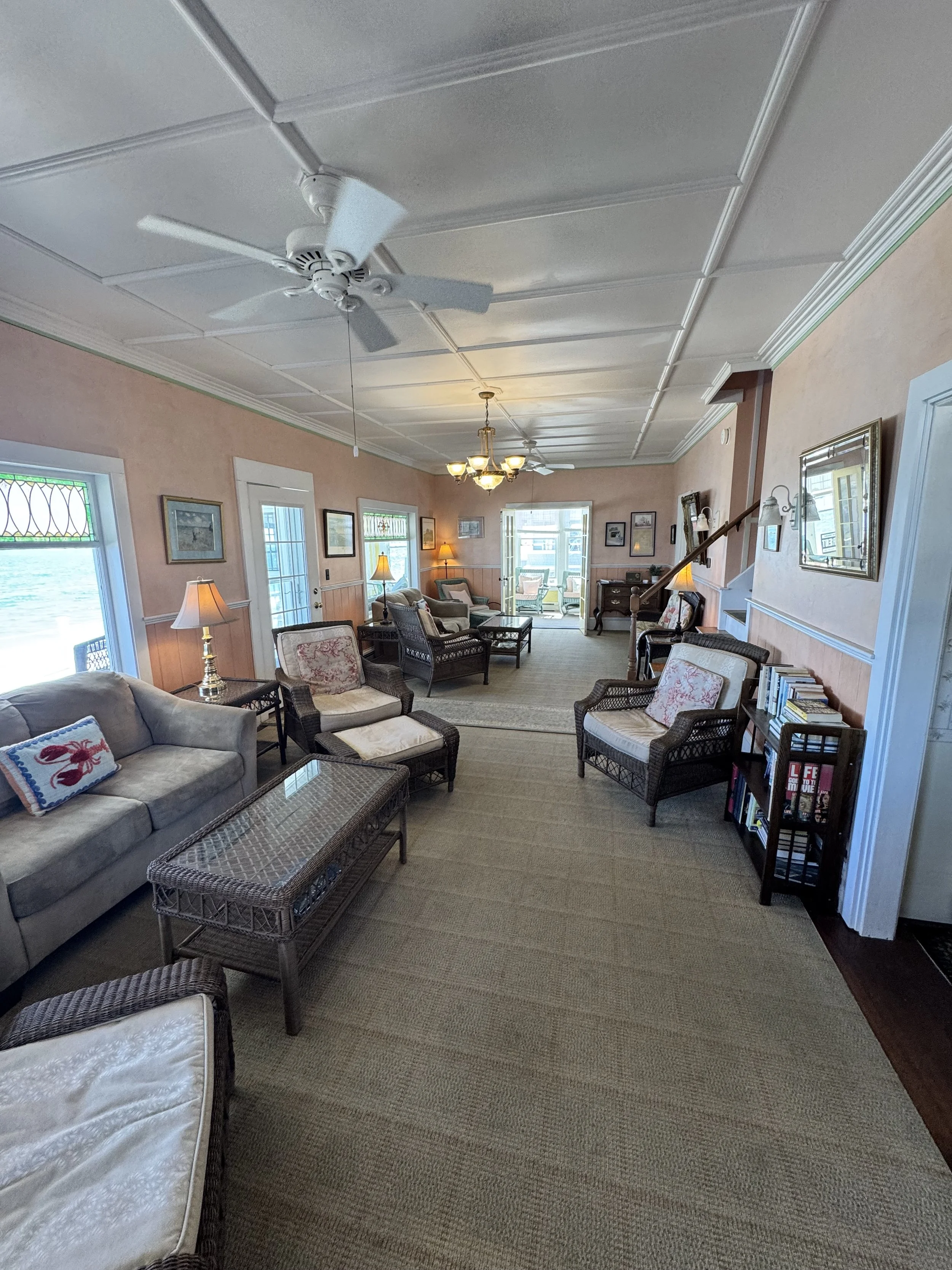 The living room features ample seating for large groups. 