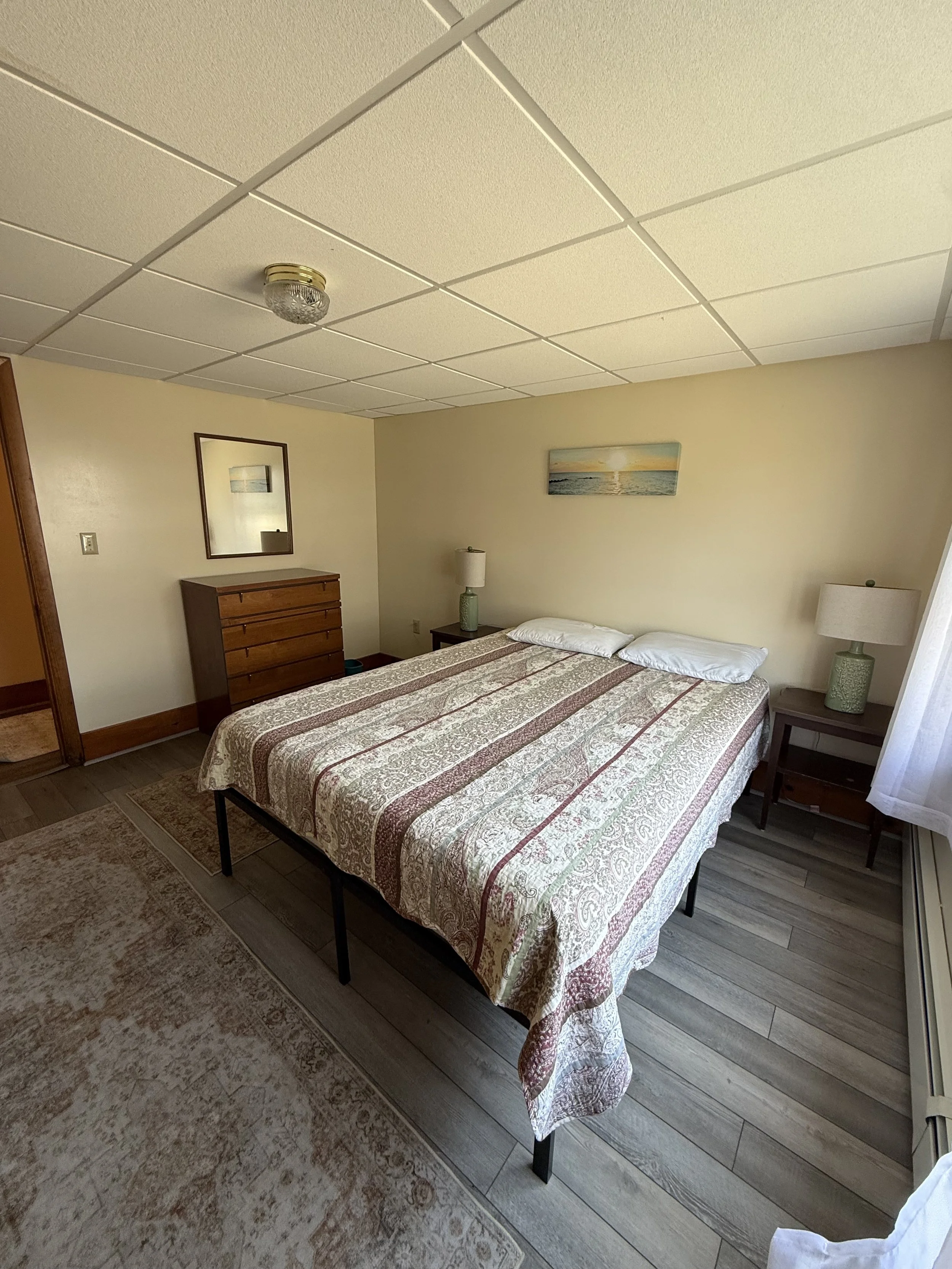 Apartment 1 Bedroom 1: features a queen bed. 
