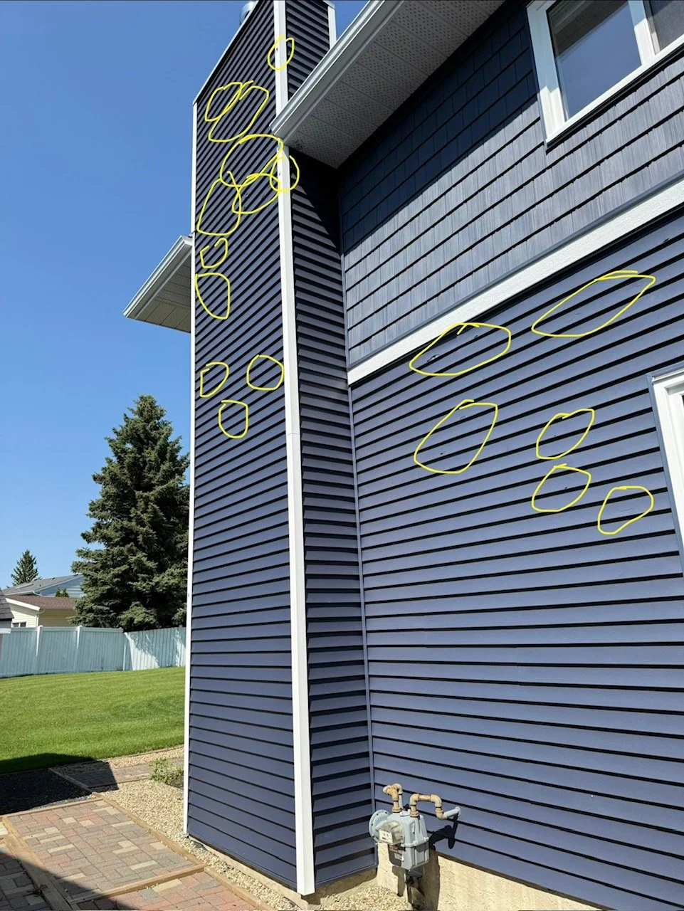 hail-damage-to-vinyl-in-edmonton-ab.JPG