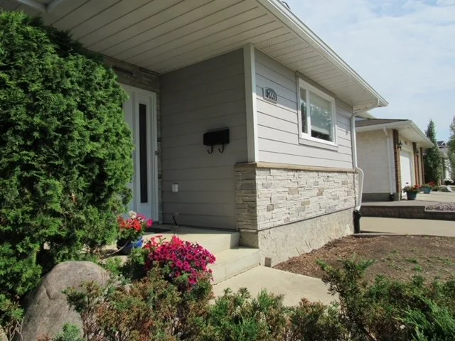 Hardie Plank and versetta stone on an Edmonton siding renovation.