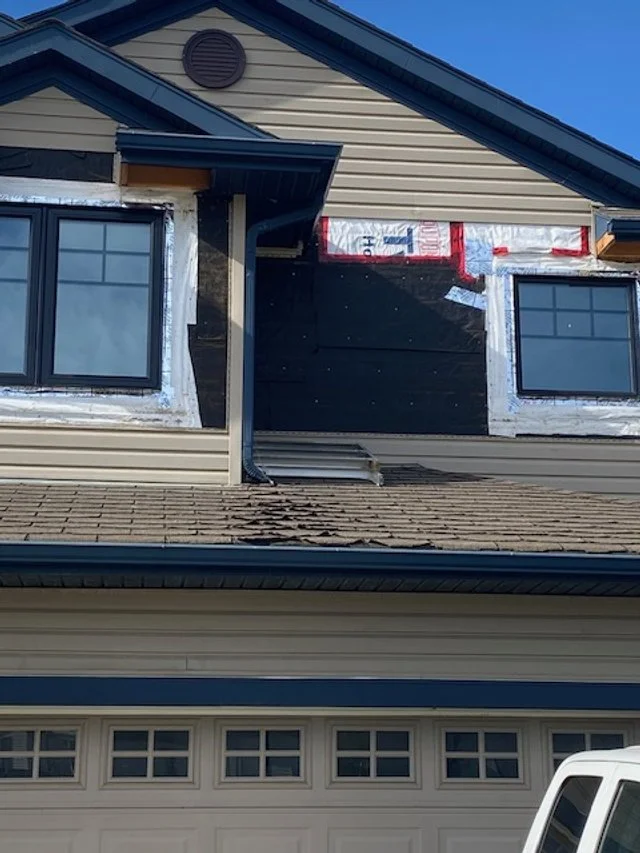 This photo shows a vinyl siding repair project in Edmonton AB.