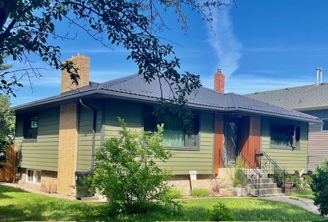 Cool looking home with Mountain Sage Hardie Board and Lux Panel Accent - Edmonton