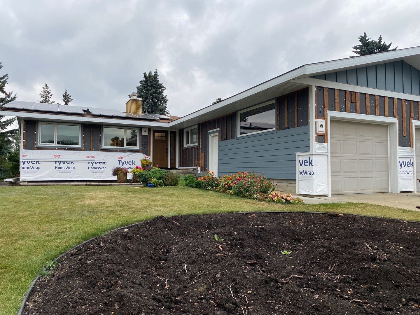 Hardie siding going on top of exterior insulation and strapping on an Edmonton home.