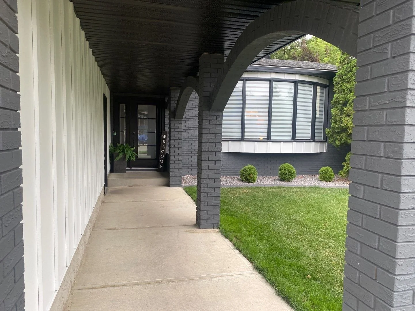 HardiePanel board & batten at a front entry on a home in Edmonton.