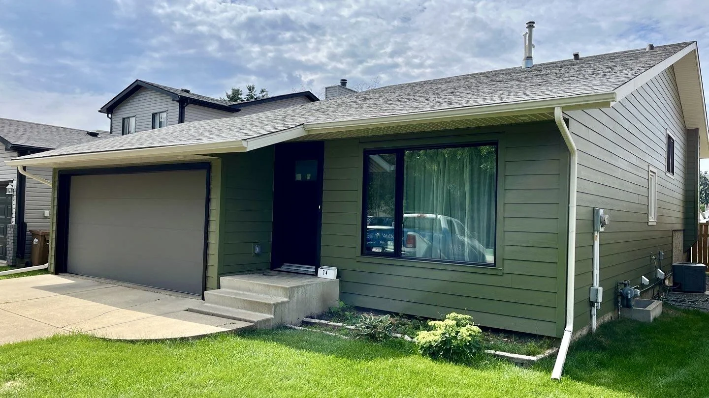 Contemporary Hardie Siding Exterior in Mountain Sage with black trims St Albert