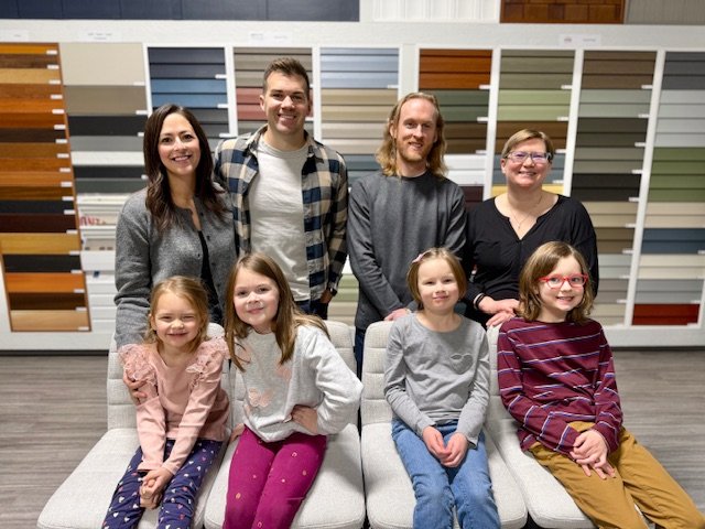 The owners of Blue Jay Exterior Renovations with their families.