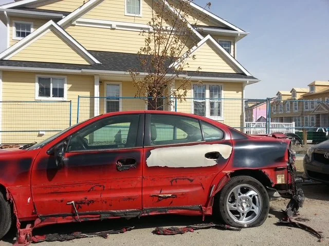 Another car melting from Mckenzie Town Fire damage