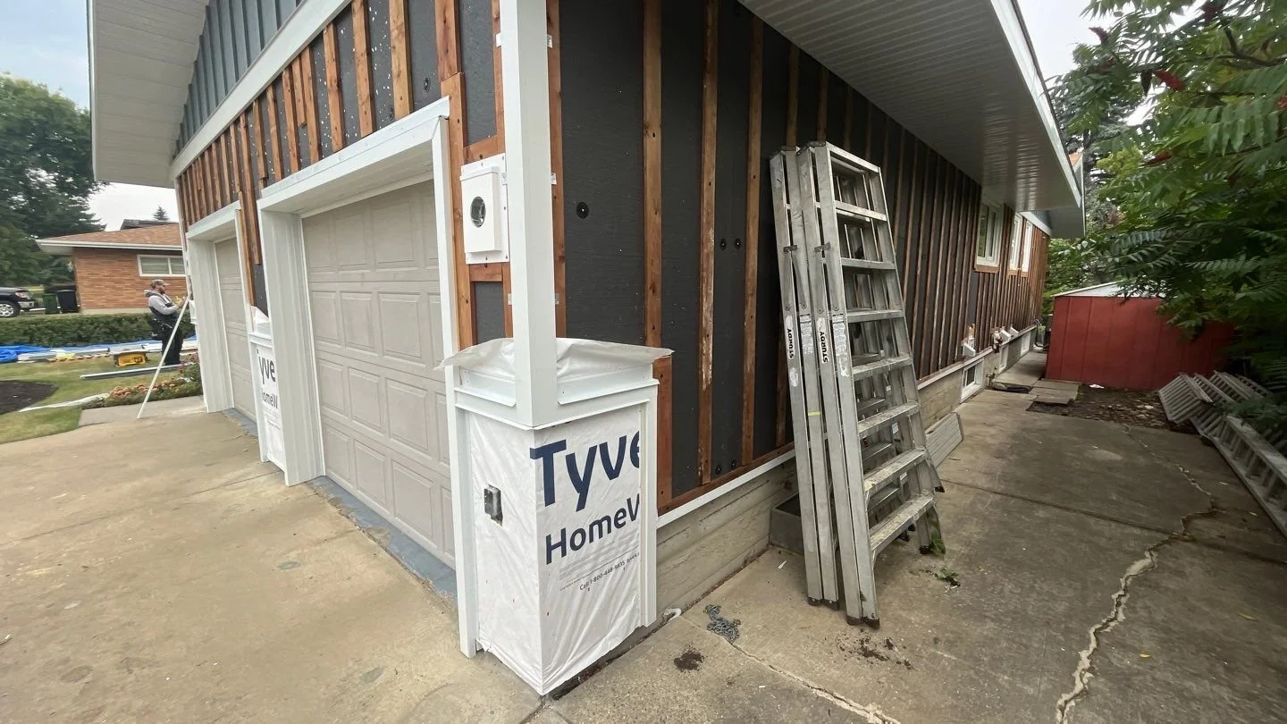 Exterior Insulation and strapping being installed on an Edmonton siding renovation