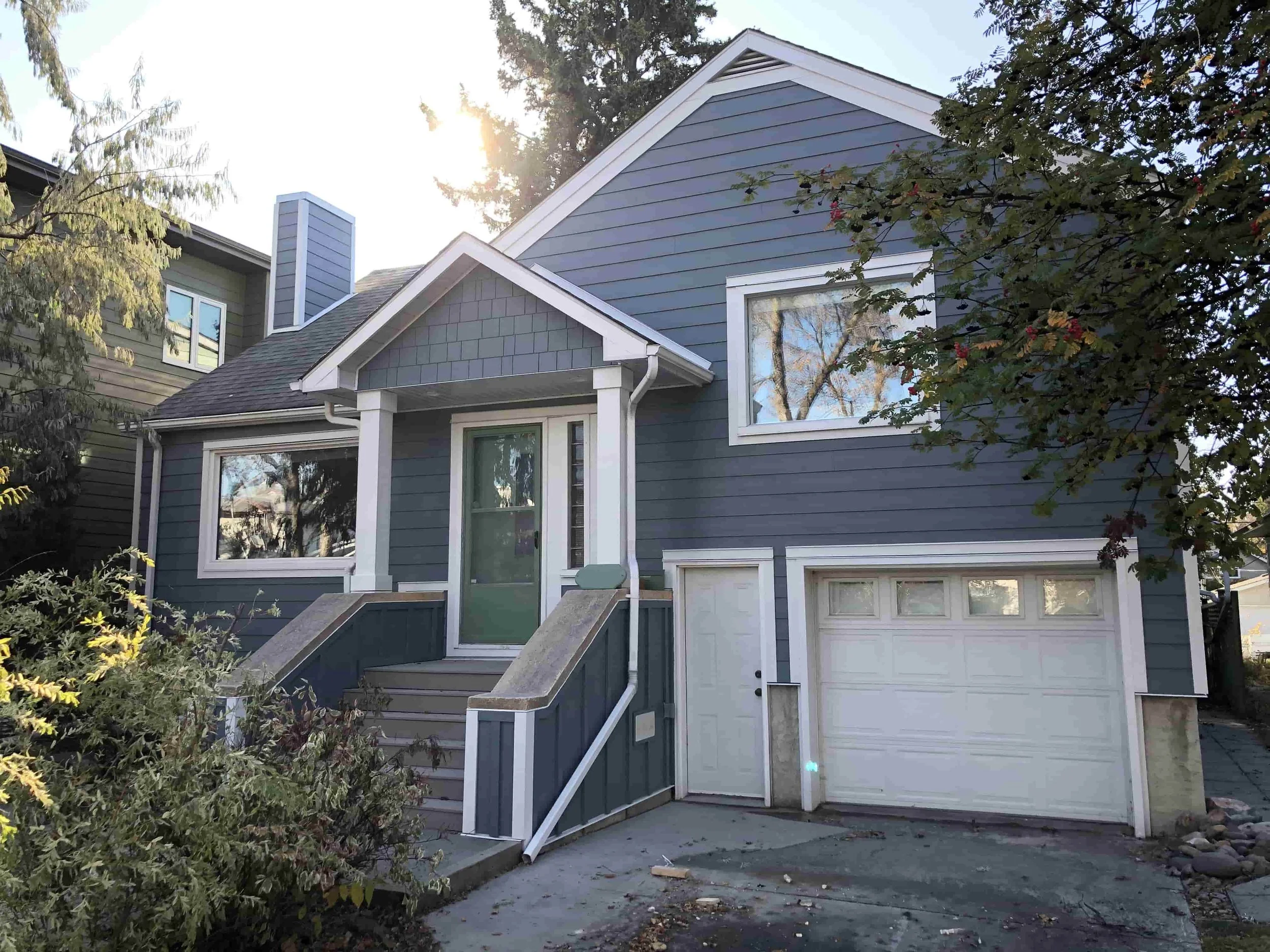 An Edmonton two storey home recently re-sided with Hardie siding in Boothbay Blue.