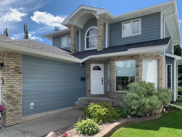 Boothbay Blue James Hardie siding installed on a beautiful Edmonton area home.