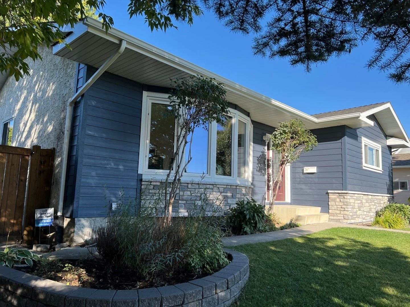 This bungalow in west Edmonton features Deep Ocean HardiePlank lap siding and a beautiful masonry accent.
