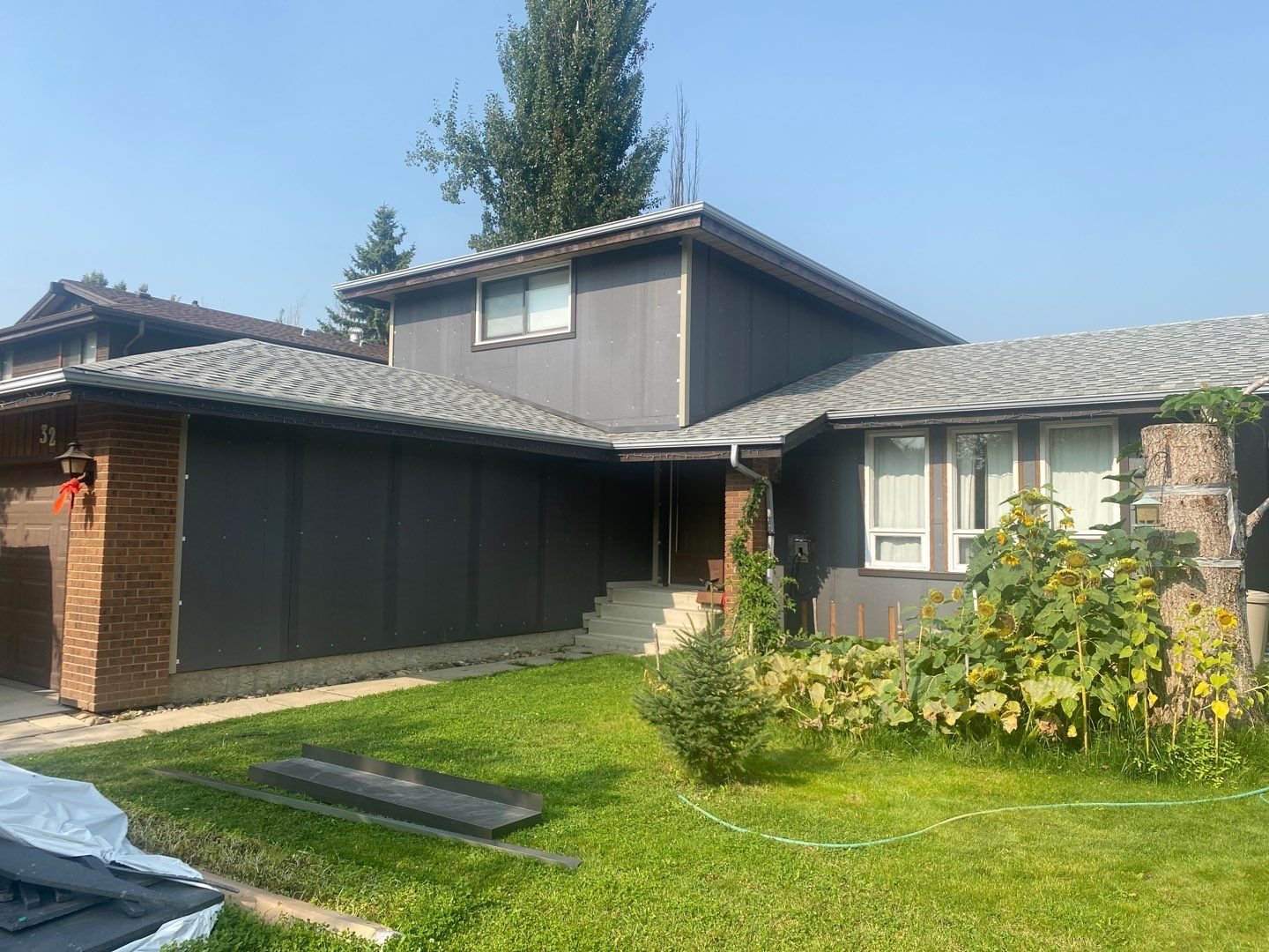 This photo shows a renovation project that's in process, including new exterior insulation boards.