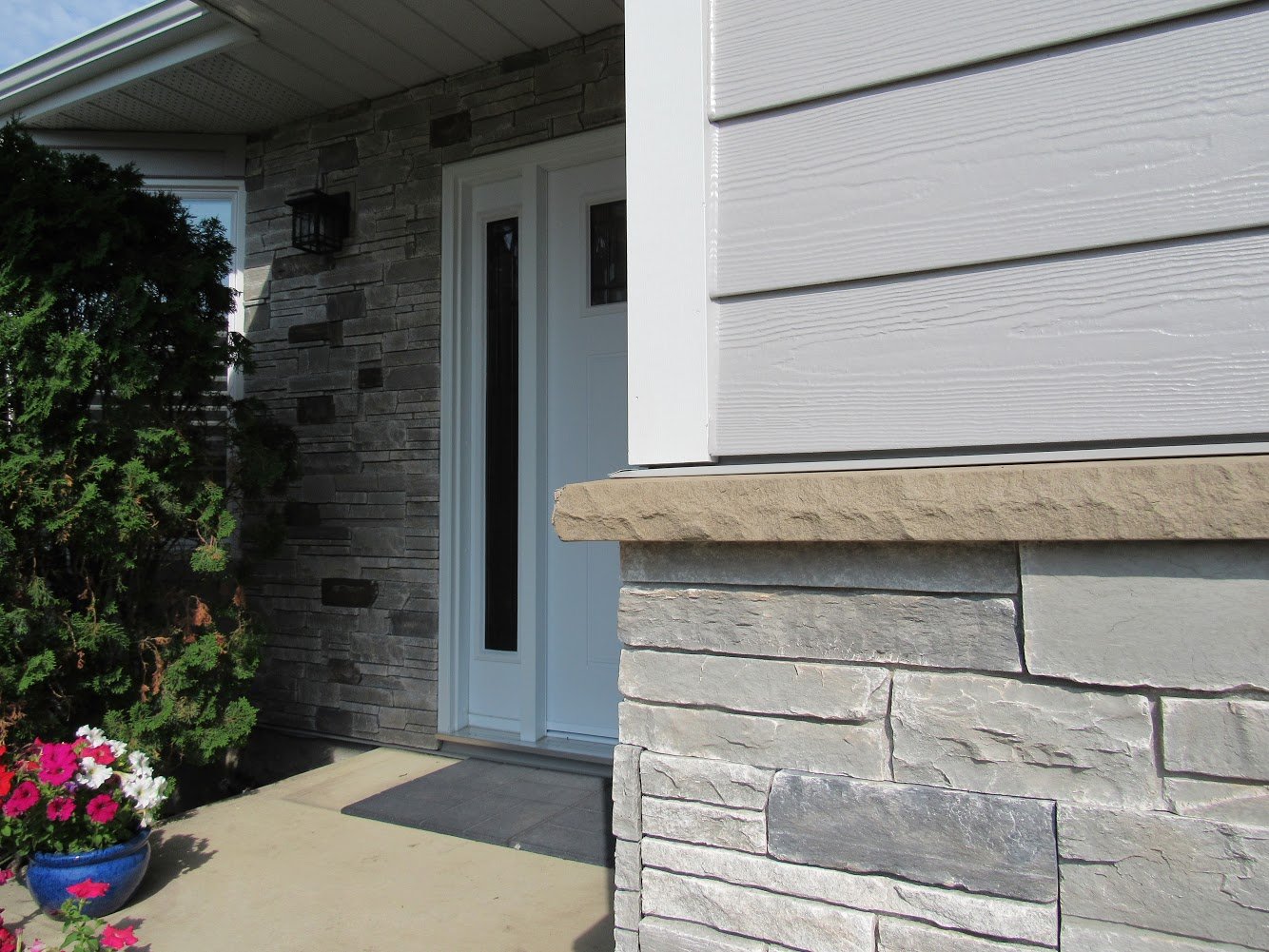 A manufactured stone veneer installed on an edmonton siding renovation