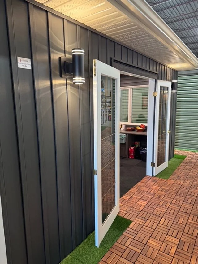 Vinyl board and batten display on a model home at Blue Jay Exterior Renovations showroom.
