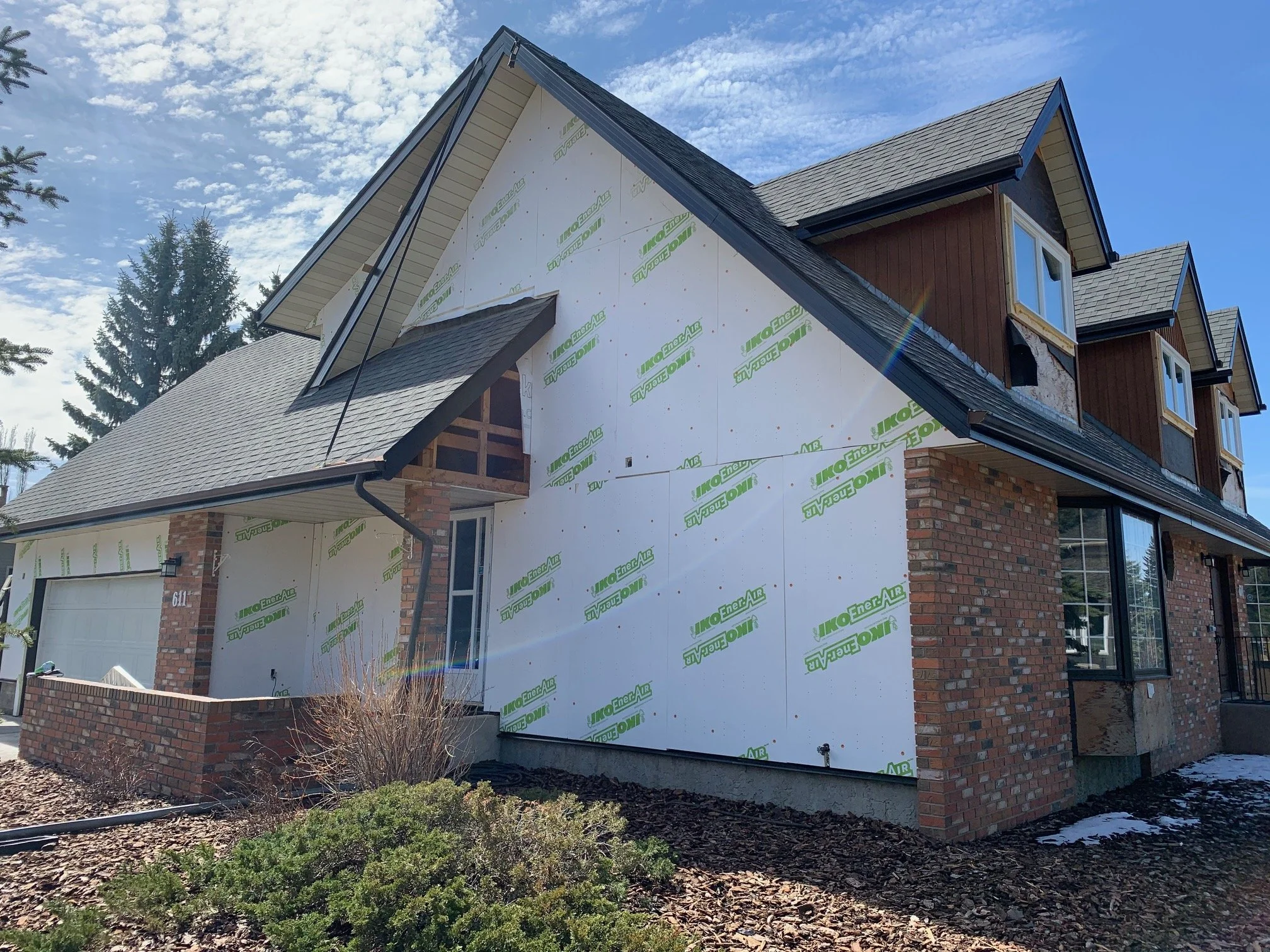 A progress photo of a two story home in Edmonton featuring exterior insulation.