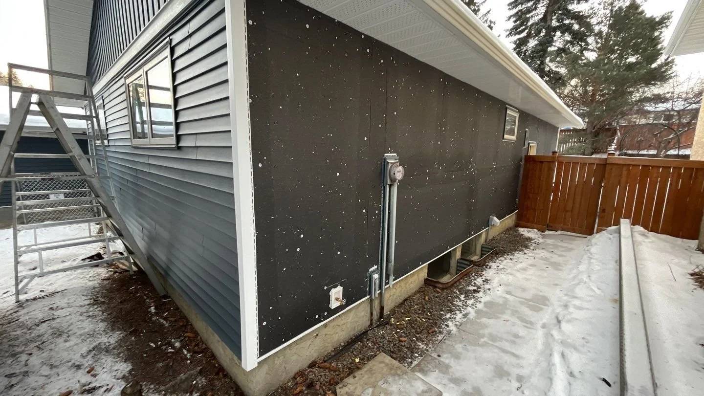 Siding renovation in Edmonton featuring vinyl siding and exterior insulation