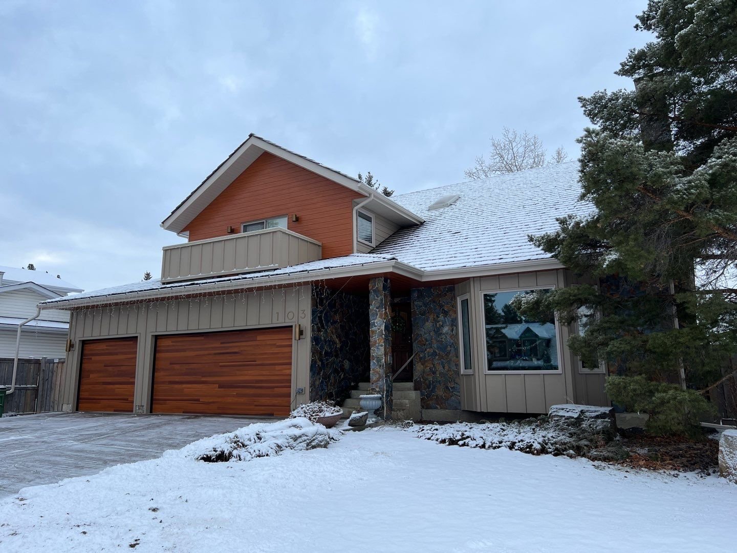 Lux V-Groove siding panels in Suede along with Hardie siding in Khaki Brown