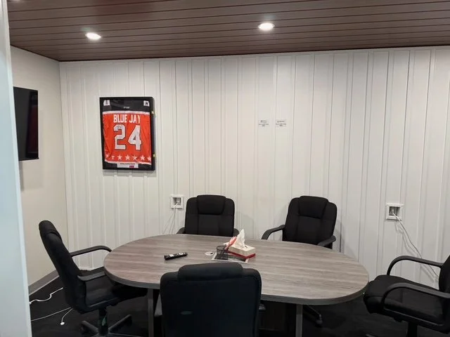 Inside a model home featuring more siding installation displays at the Blue Jay Exterior Renovations office.