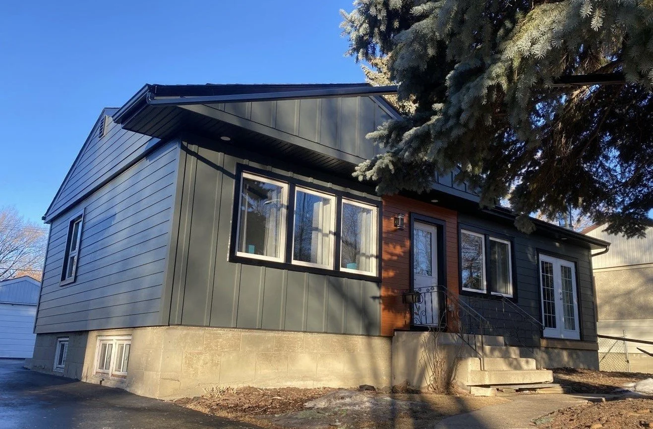 Iron Gray Hardie Board and Batten with a lux panel accent - Edmonton