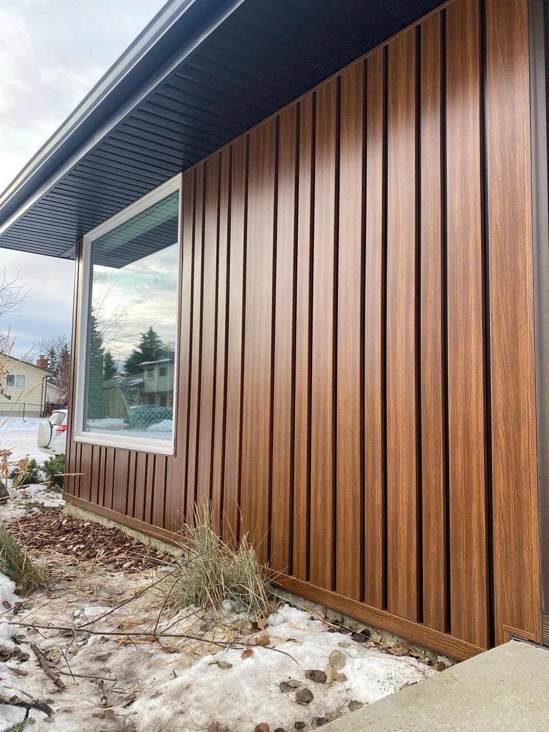 Siding that looks like wood installed as a feature on an Edmonton home exterior.