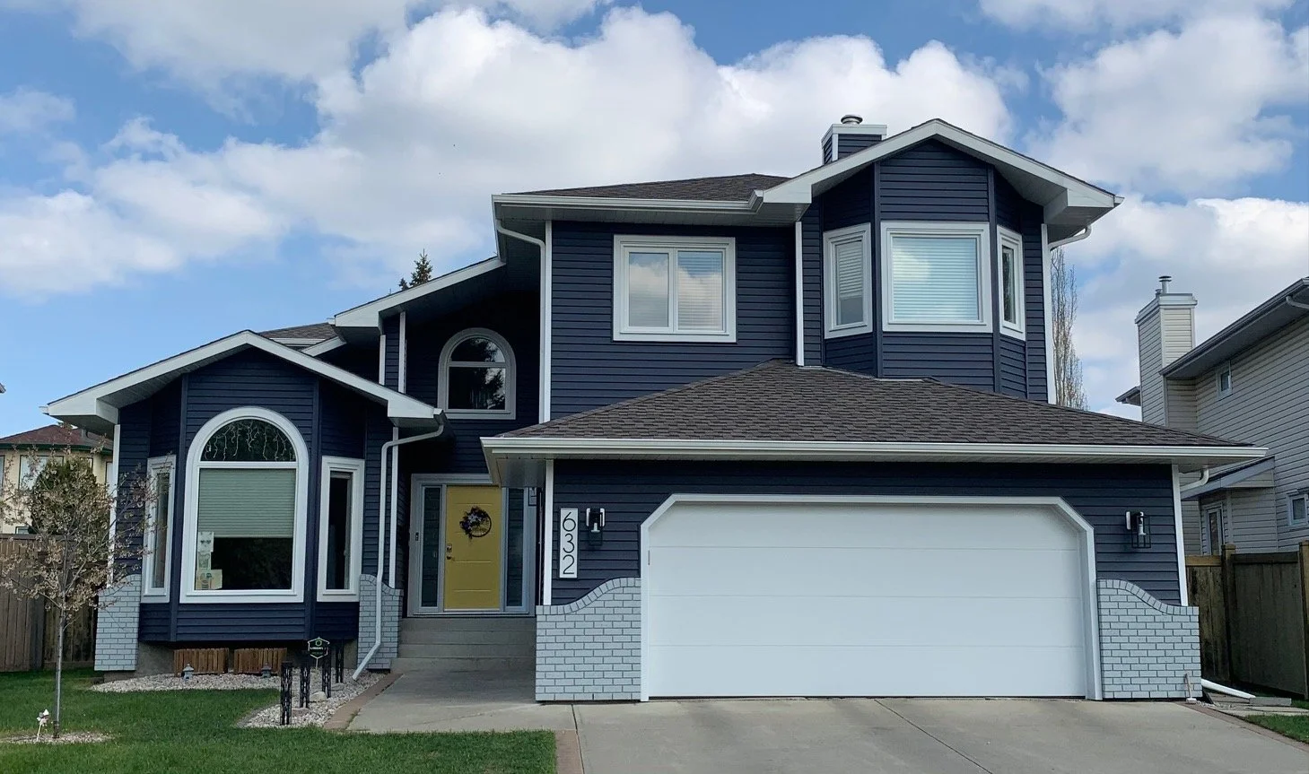 Navy Blue Siding Yellow Door.jpg