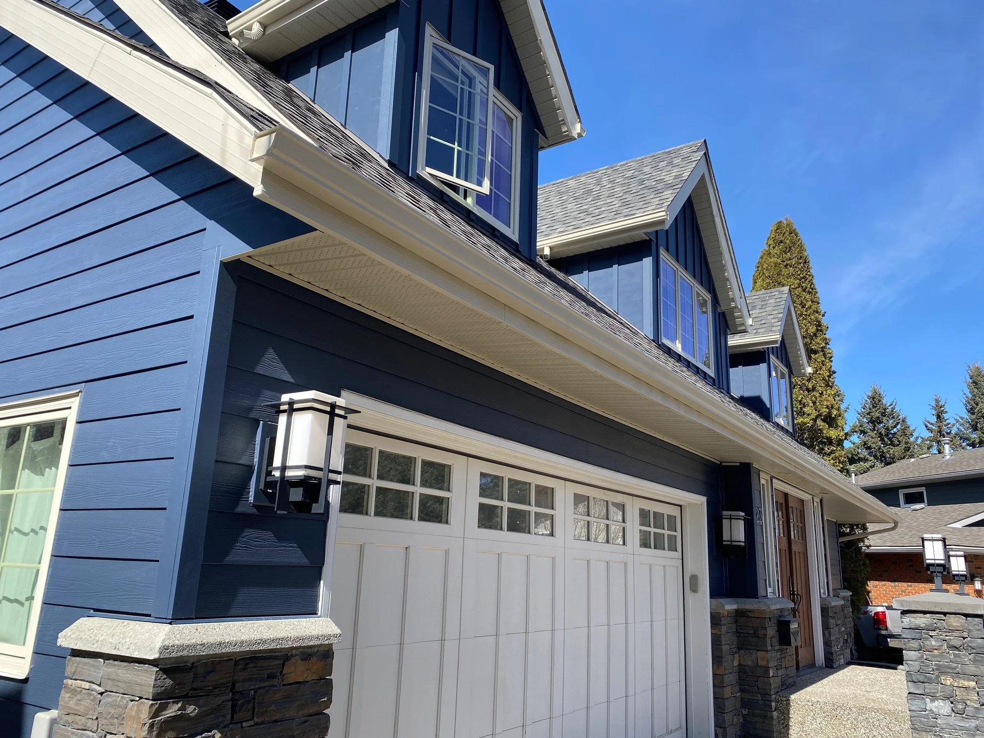Gentek Almond soffit, fascia, and eavestrough on a project in St. Albert AB.