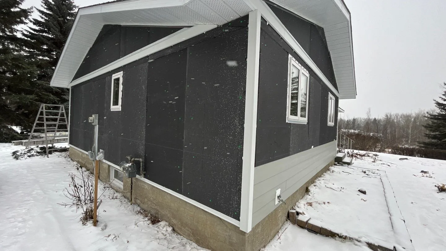 Hardie Plank being installed on an exterior renovation, over top of insulation in Edmonton