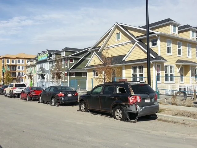 Hardie siding holding up to extreme heat while a mini van melts on the street beside it