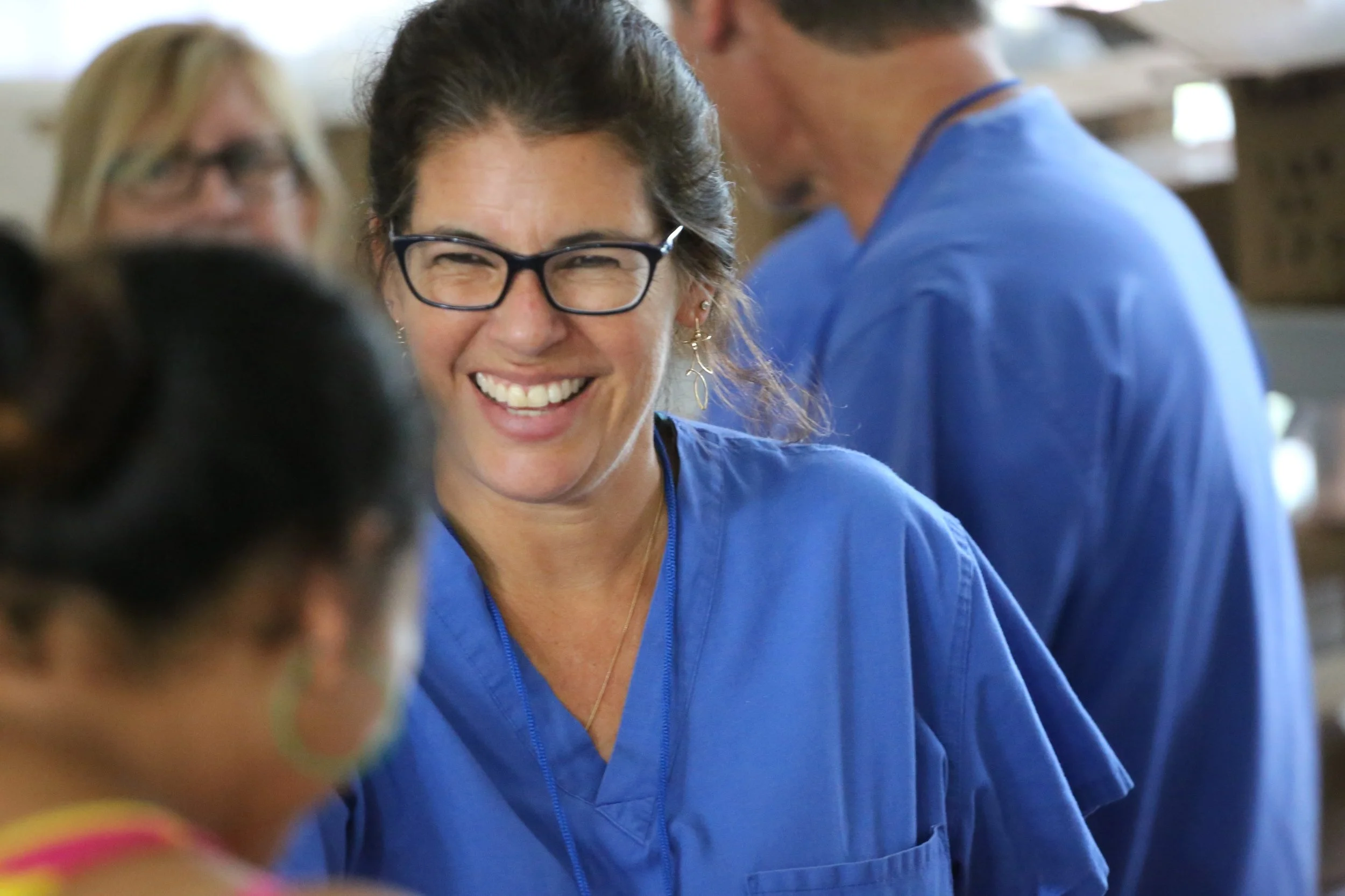  Member of the eye-team distributes glasses 