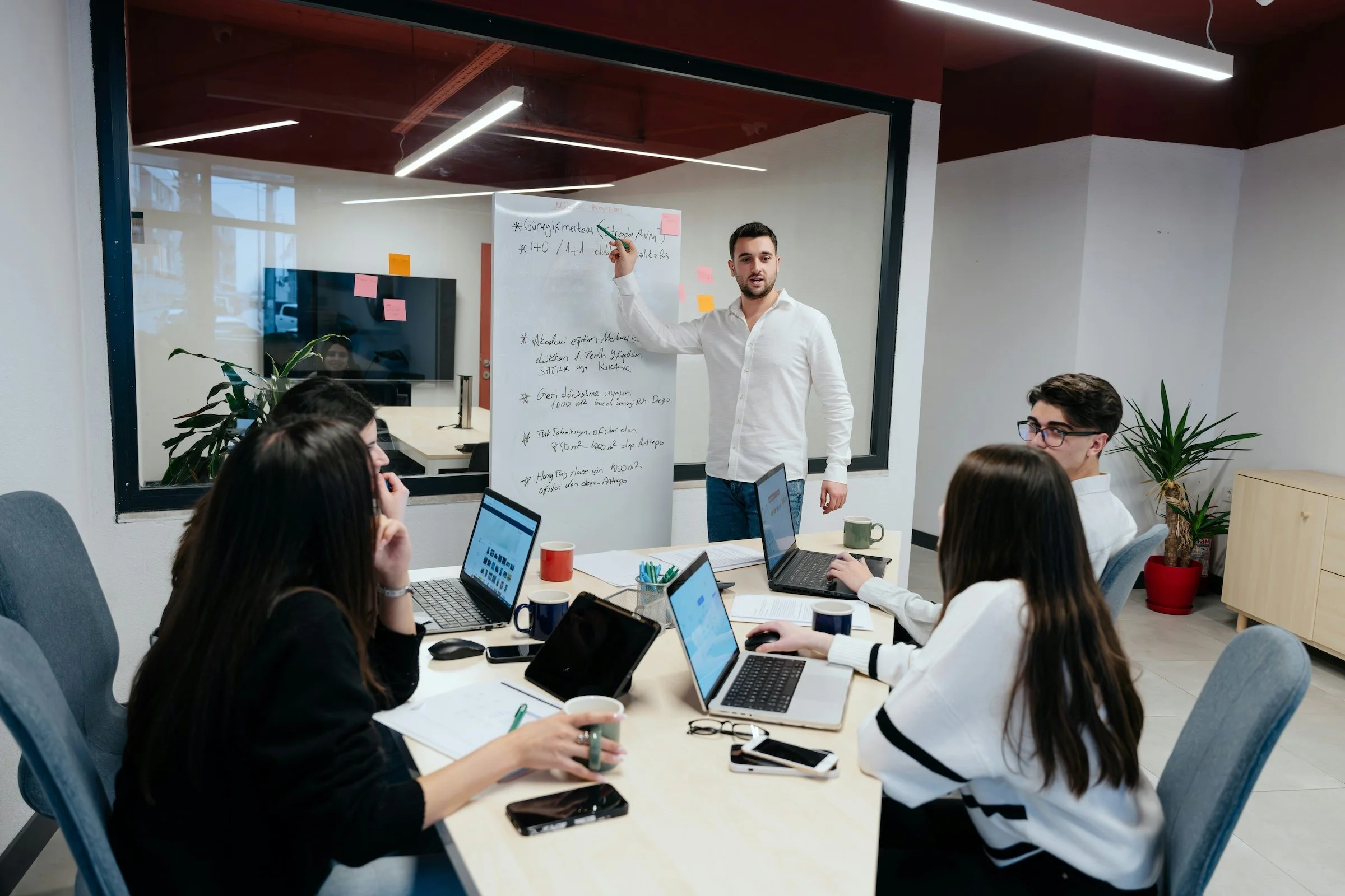 a small group of people in a work meeting