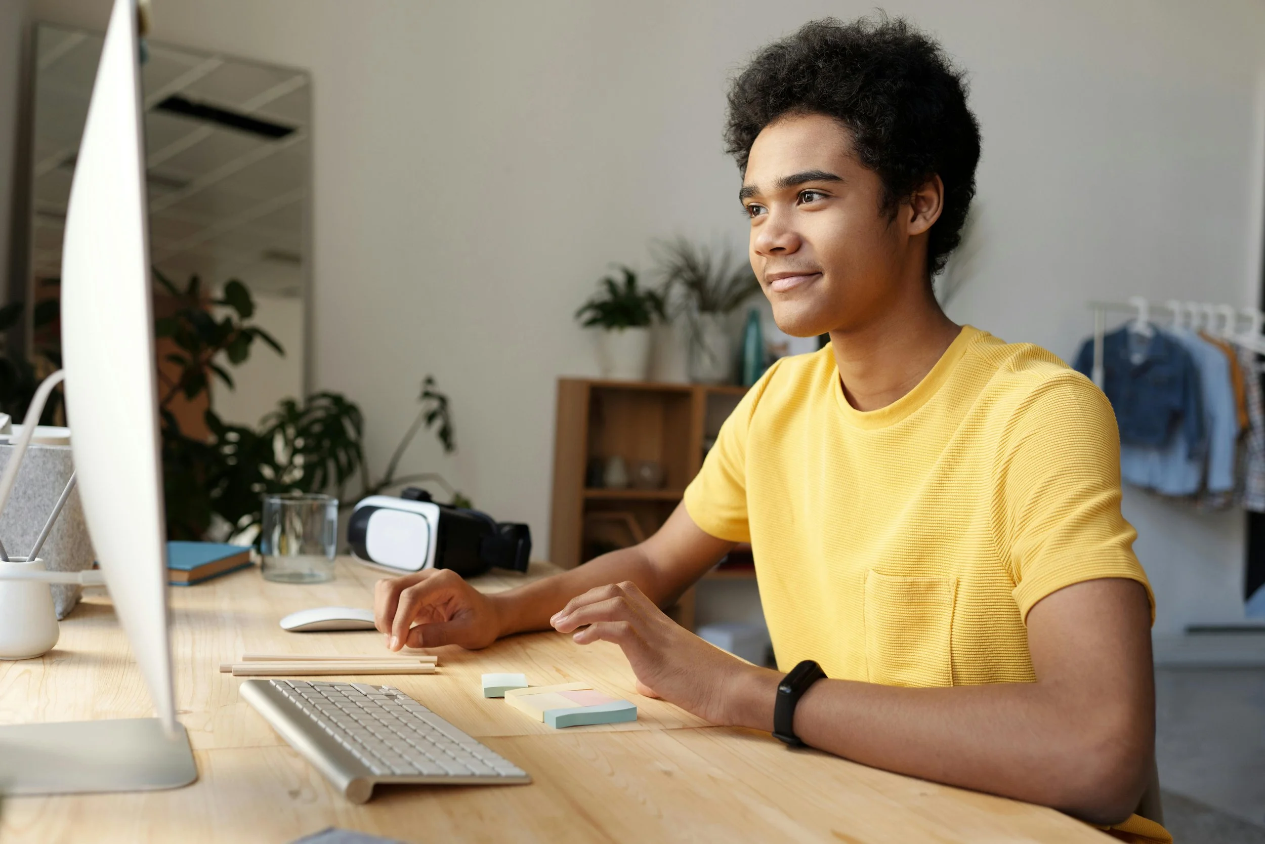 oy sitting at a desk using a computer during ADHD evaluation and testing