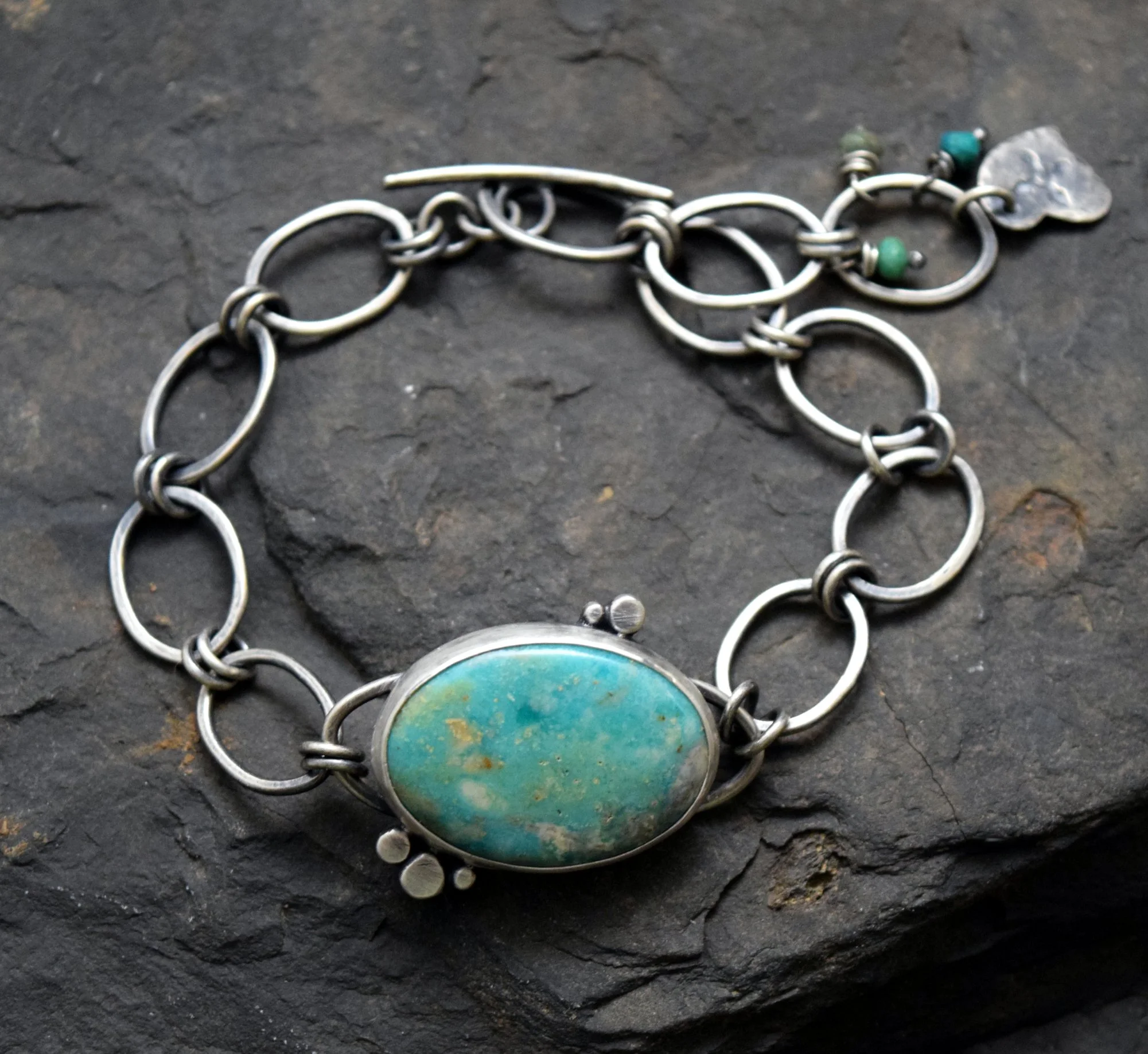 Riverside Teal Kingman Turquoise Bracelet in Sterling Silver with Handmade Large Link Chain & Charms