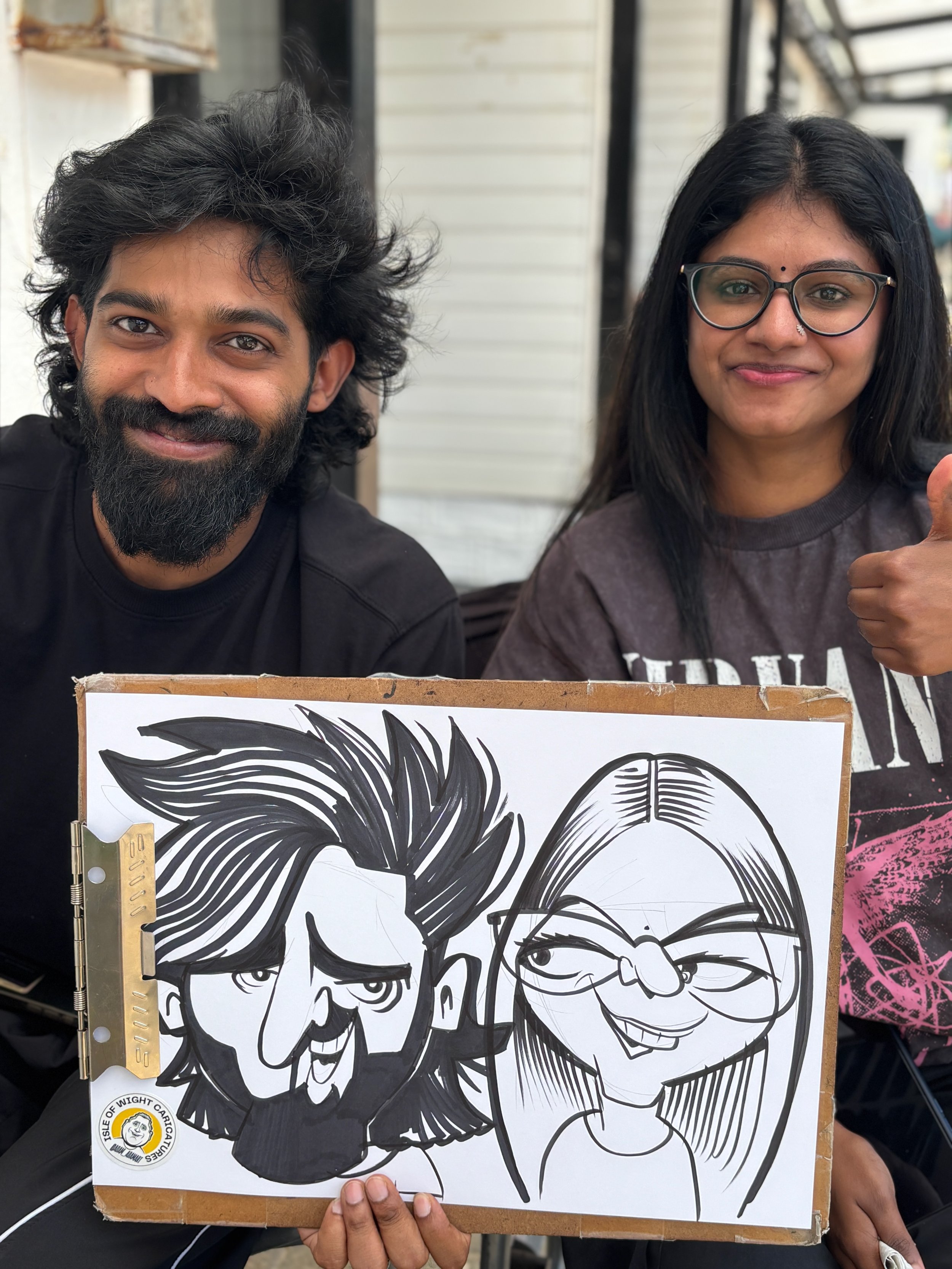Live caricature artist drawing guests at a wedding, Chichester, West Sussex