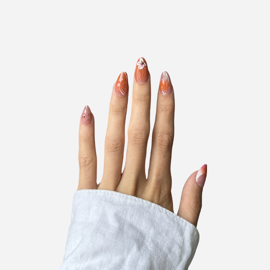 Minimal, glossy french tip press-on nails styled with a white long sleeve for an effortless look.