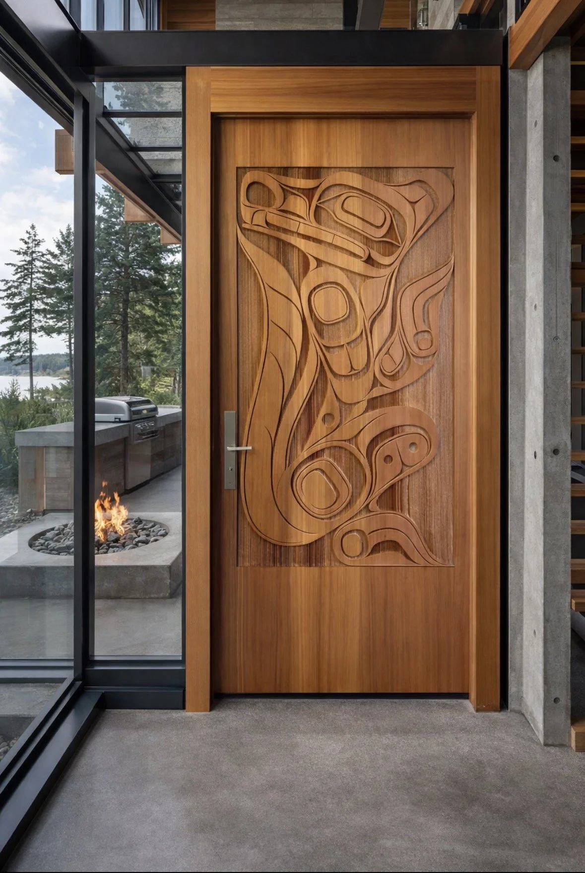 Sand carved red cedar exterior door, natural finish. 