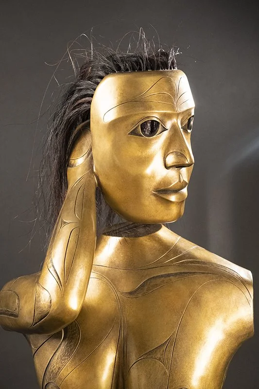 Bronze cast of torso.