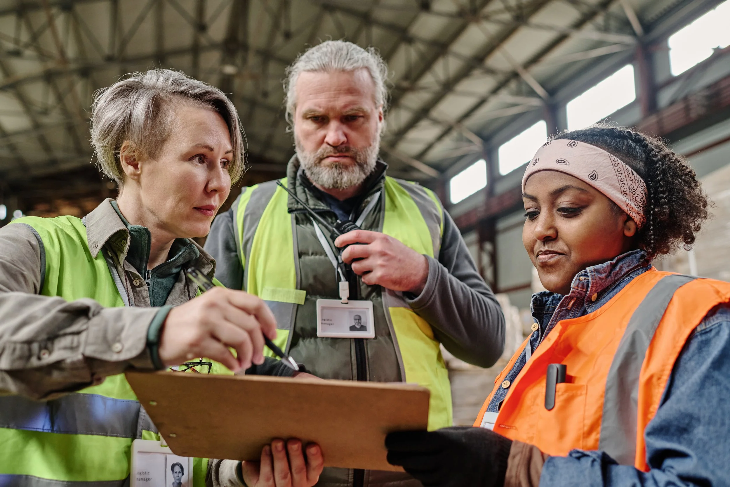 foreman-discussing-invoice-with-workers-2023-11-27-04-49-38-utc.jpg