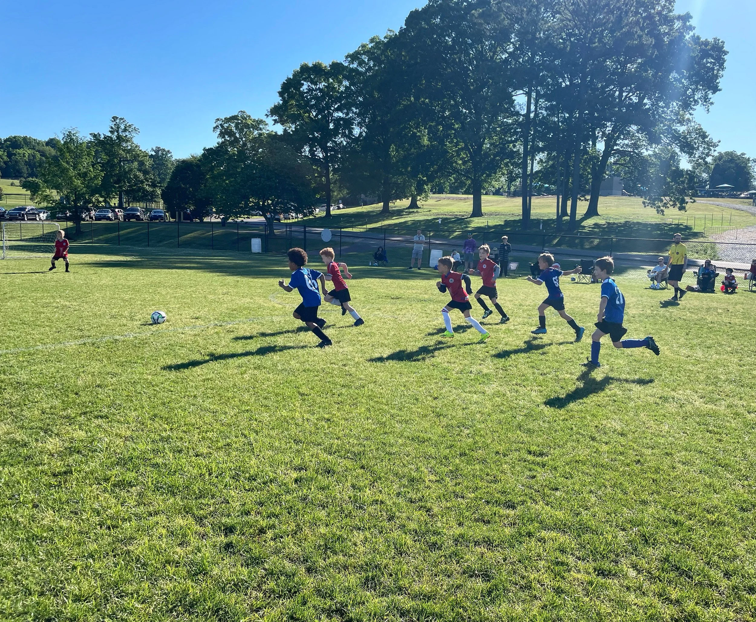 8U athletes competing in a soccer game