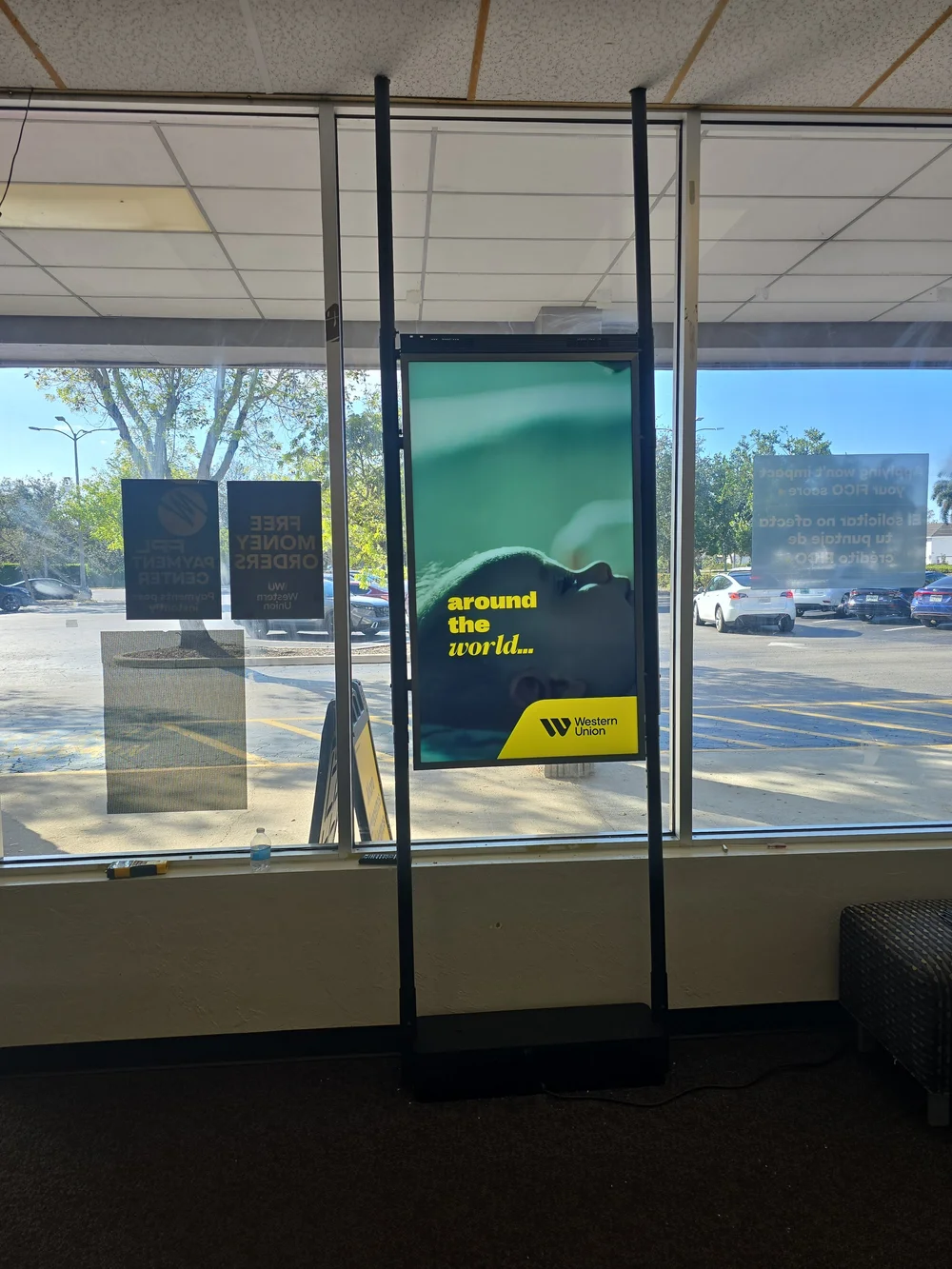 Digital signage screen installed for a Western Union store in Naples