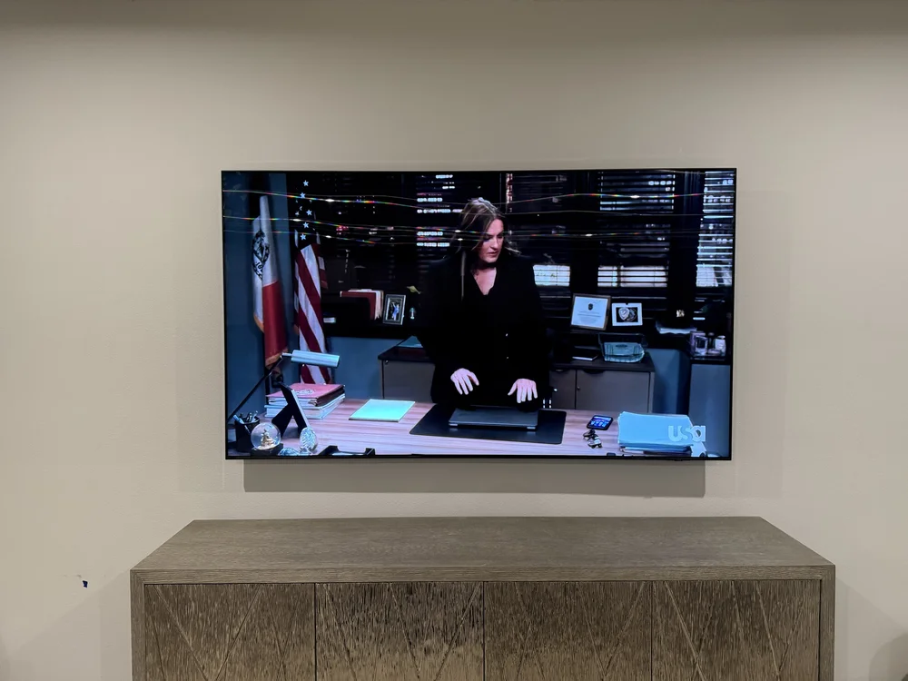 Television screen displaying news broadcast in Naples client home