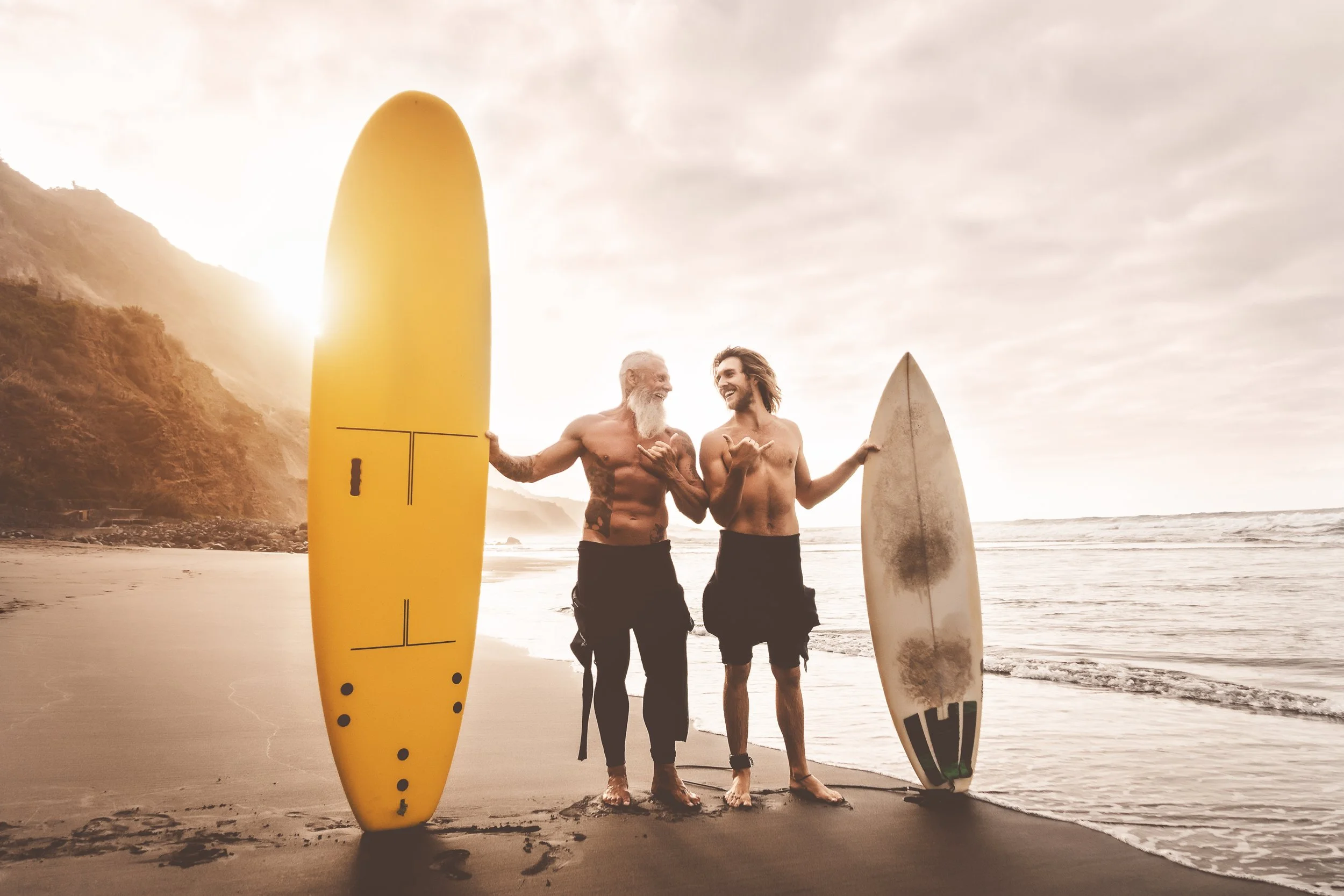 happy-friends-surfing-together-on-tropical-ocean-2024-12-01-02-33-08-utc.jpg