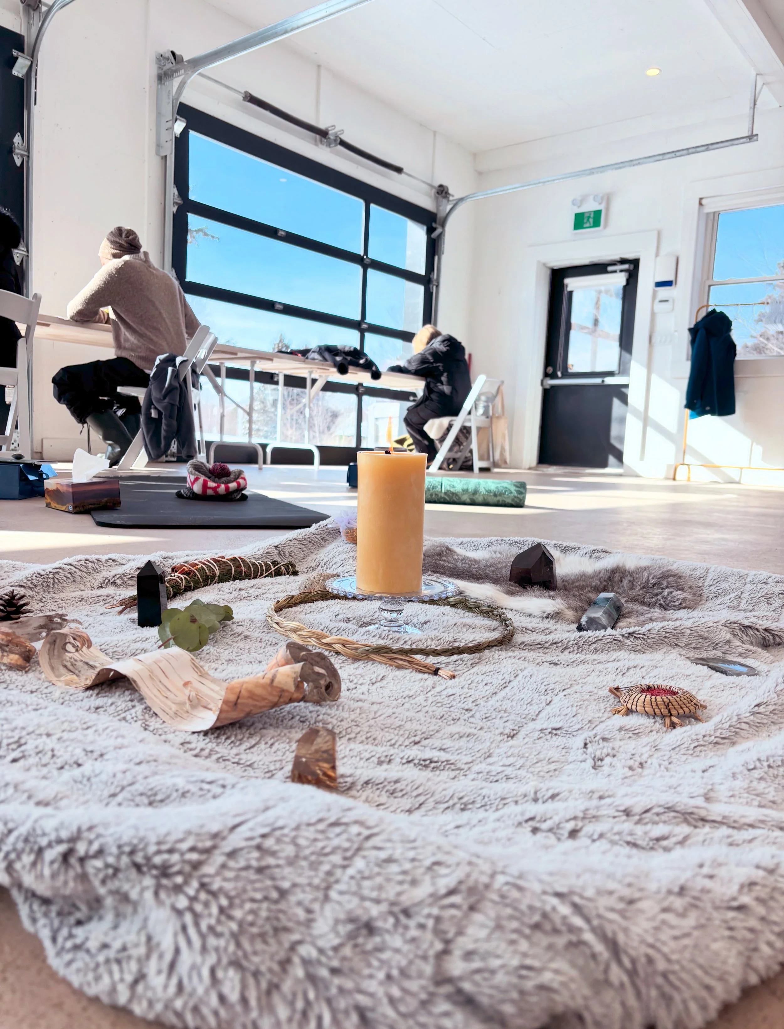 People journaling behind a shared altar